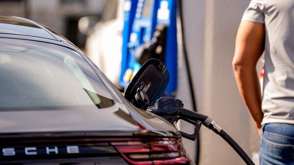 WASHINGTON, DC - MARCH 31: A customer pumps gas at an Exxon gas station near the U.S. Capitol Building on March 31, 2026 in Washington, DC. The national average of one gallon of gas has risen to roughly $4.02 amid the ongoing war with Iran.   Andrew Harnik/Getty Images/AFP (Photo by Andrew Harnik / GETTY IMAGES NORTH AMERICA / Getty Images via AFP)