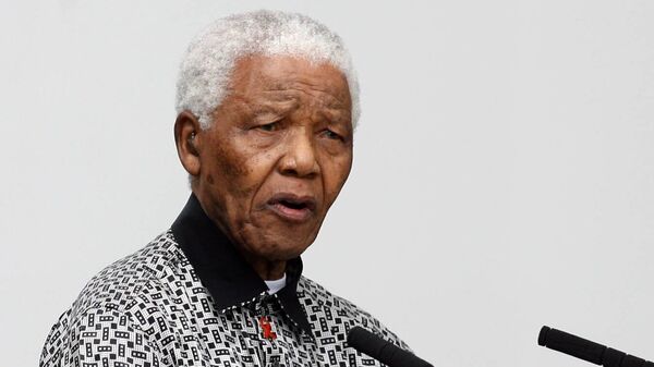 Nelson Mandela, former president of South Africa, speaks at a ceremony to unveil a statue of himself in Parliament Square, London.
