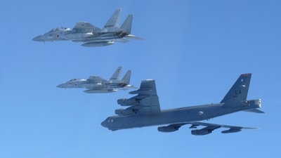 This photo provided by Japan's Ministry of Defense shows the Japan Air Self-Defense Force's F-15 fighters holding a joint military drill (AP)