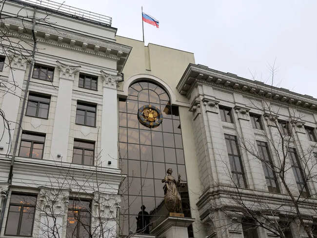 A Russian state flag flies above the building of the Supreme Court