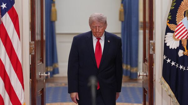 US President Donald Trump arrives to speak about the Iran war from the Cross Hall of the White House on Wednesday, April 1, 2026, in Washington.