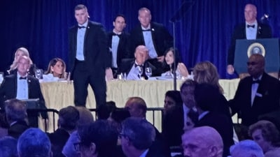 US Secret Service agents surround President Donald Trump before he was taken from the stage after a shooting incident outside the ballroom during the White House Correspondents Dinner, Saturday, April 25, 2026, in Washington. (AP)