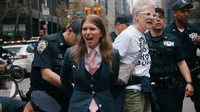 Chelsea Manning, center, is arrested by police as protesters with Jewish Voice for Peace block traffic during a demonstration outside the New York office of U.S. Sen. Chuck Schumer, calling for an end to the U.S.-Israel war with Iran and opposing U.S. weapons support on Monday, April 13, 2026, in New York. (AP Photo/Andres Kudacki) (AP)