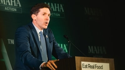 Calley Means, senior advisor at Health and Human Services (HHS) and co-founder of TrueMed, speaks during an "Eat Real Food" rally at Brazos Hall in Austin, Texas. (Bloomberg)