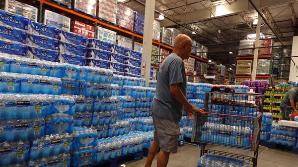 BURBANK, CALIFORNIA - APRIL 01: Cases of bottled water are displayed for sale at a Costco store on April 01, 2026 in Burbank, California. Justin Sullivan/Getty Images/AFP (Photo by JUSTIN SULLIVAN / GETTY IMAGES NORTH AMERICA / Getty Images via AFP)