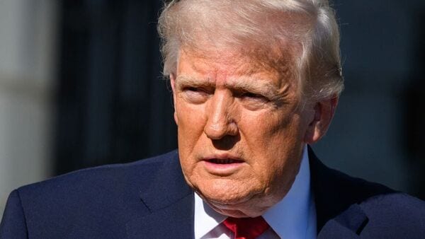 The now-deleted image, posted on Truth Social on Sunday, showed Trump in a white robe holding a glowing orb while placing his hand on a man’s forehead as if performing a healing, surrounded by patriotic symbols