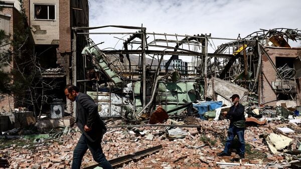 People inspect the damage at the research building of the Shahid Beheshti University, which was damaged by a strike, amid the U.S.-Israeli conflict with Iran, in Tehran, Iran, on April 4, 2026.