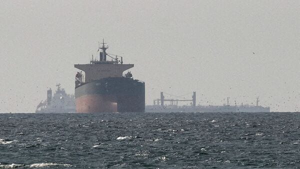 Cargo ships in the Gulf, near the Strait of Hormuz, as seen from northern Ras al-Khaimah, near the border with Oman’s Musandam governance, amid the U.S.-Israeli conflict with Iran, in United Arab Emirates, March 11, 2026.