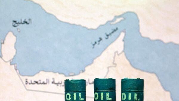 US Iran ceasefire Live Updates: FILE PHOTO: A map showing the Strait of Hormuz, also known as Madiq Hurmuz, and 3D printed oil barrels are seen in this illustration taken March 26, 2026. REUTERS/Dado Ruvic/Illustration/File Photo