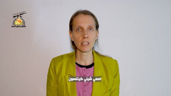 A still image taken from a video released April 7, 2026 by a social media outlet close to Iraqi armed group Kataib Hezbollah purporting to show U.S. journalist Shelly Kittleson, who was kidnapped in Iraq in March, speaking at an unknown location.