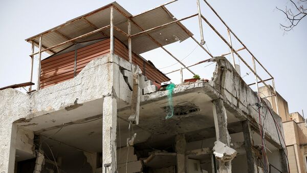 A damaged building at an impact site, following a barrage of missiles launched from Iran, amid the U.S.-Israeli conflict with Iran, in Ramat Gan, Israel, April 4, 2026. (REUTERS)