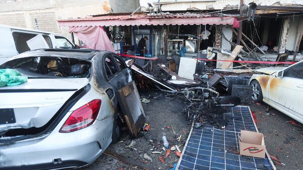 A man inspects the damage to a cafe in the aftermath of an Israeli strike in Sidon, Lebanon, April 8, 2026