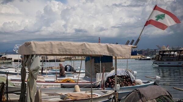 A fisherman stands in his boat, amid escalating hostilities between Israel and Hezbollah, as the U.S.-Israeli conflict with Iran continues, at a port in Tyre, Lebanon, April 7, 2026. REUTERS/Adnan Abidi