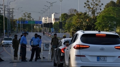 Police officers stop vehicles at a check post near the Serena Hotel, as Pakistan prepares to host the US and Iran for the second phase of peace talks in Islamabad. (REUTERS)