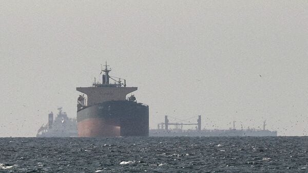 Cargo ships in the Gulf, near the Strait of Hormuz, as seen from northern Ras al-Khaimah, near the border with Oman’s Musandam governance, amid the U.S.-Israeli conflict with Iran, in United Arab Emirates, March 11, 2026.
