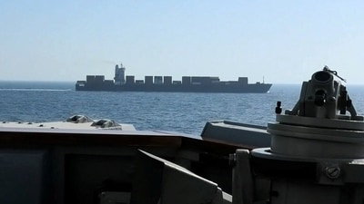 A view of Iranian-flagged cargo ship M/V Touska as the US Navy Arleigh Burke-class Aegis guided missile destroyer USS Spruance conducts its interception in a location given as the north Arabian Sea. (via REUTERS)