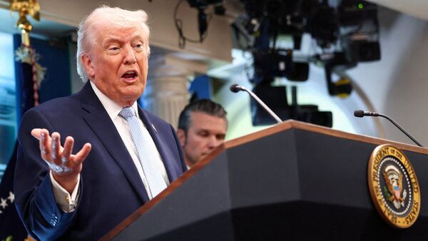 US President Donald Trump, flanked by Secretary of Defense Pete Hegseth, speaks during a press conference in the James S. Brady Press Briefing Room at the White House in Washington, D.C., U.S., April 6, 2026.