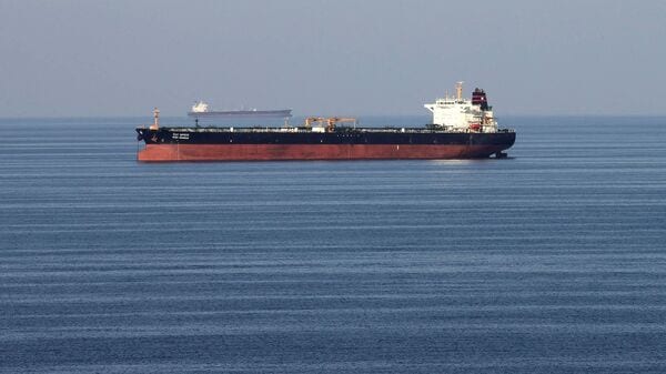 Oil tankers pass through the Strait of Hormuz.