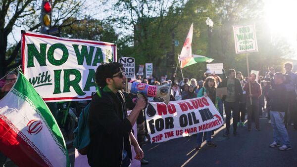 Demonstrators protest against military action in Iran after US President Donald Trump said that he had agreed to a two-week ceasefire with Iran, less than two hours before his deadline for Tehran to reopen the Strait of Hormuz or face widespread attacks on its civilian infrastructure, outside the White House in Washington, DC, U.S., April 7, 2026.