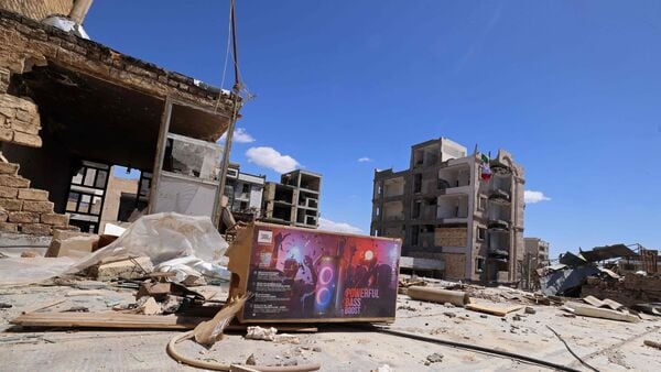 Residential buildings that were damaged by recent strikes are pictured at Vahdat town in Karaj, southwest of Tehran on April 3, 2026. (AFP)
