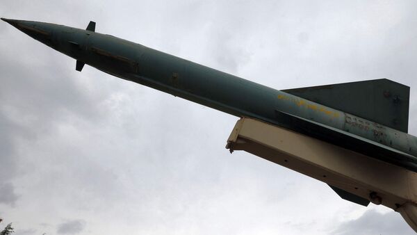 A mockup of a domestically-made Iranian missile is displayed at an exhibition outside the Defence Museum in Tehran on March 31, 2026.