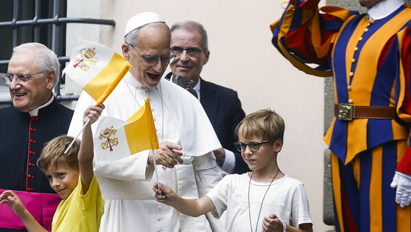 Pope Leo XIV greet children at the end of the Angelus prayer in Castel Gandolfo, Italy, Friday, Aug.15, 2025. (Angelo Carconi/Pool Via AP)