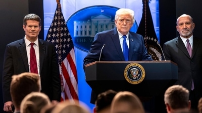 Donald Trump, Howard Lutnick, US commerce secretary, right, and John Sauer, US solicitor general, left, during a news conference (Bloomberg)