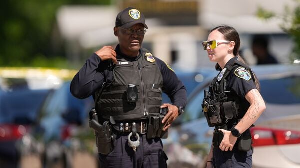 Police work outside the scene of a mass shooting, Sunday, April 19, 2026, in Shreveport, La.