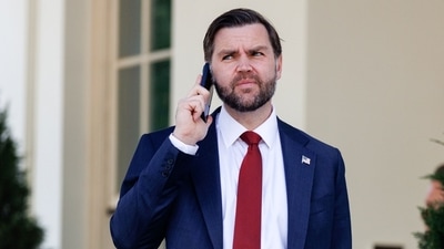 US Vice President JD Vance speaks on the phone following a swearing-in ceremony for Colin McDonald, assistant attorney general for fraud enforcement, not pictured, outside the White House in Washington, DC, US. (Bloomberg)