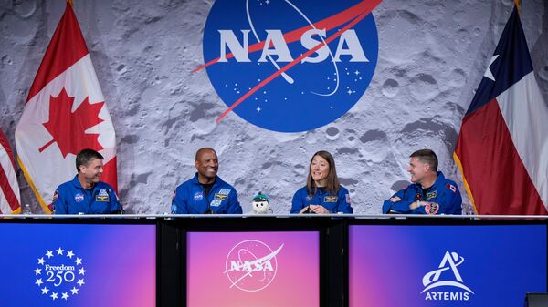 Artemis II astronauts Reid Wiseman, Victor Glover, and Christina Koch, and Canadian Space Agency (CSA) astronaut Jeremy Hansen during a press conference on Thursday, April 16, 2026, in Houston.