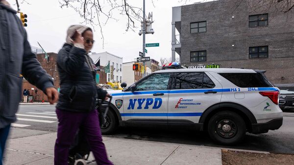 People walk by the corner where a 7-month-old baby was killed by a stray bullet while sitting in her stroller in Brooklyn Wednesday afternoon on April 02, 2026 in New York City.