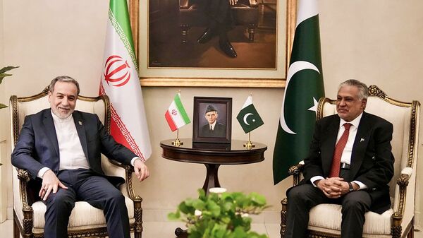 Pakistan Foreign Minister Ishaq Dar (L) greeting his Iranian counterpart Abbas Araghchi upon his arrival in Islamabad on April 24, 2026.