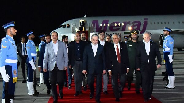 This handout photograph taken and released by Pakistan's Prime Minister's Office on April 25, 2026, shows Pakistan's Foreign Minister Ishaq Dar (C-R) and Army Chief Syed Asim Munir (2ndL) walking with Iran's Foreign Minister Abbas Araghchi (C) upon his arrival at Nur Khan air base in Rawalpindi, near Islamabad.