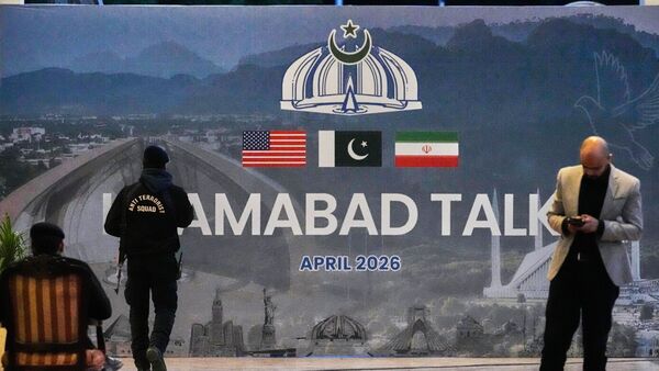 A billboard of the US-Iran talks outside a media centre set up for the coverage of the first U.S. Iran official meeting, in Islamabad, Pakistan, Sunday, April 12, 2026.
