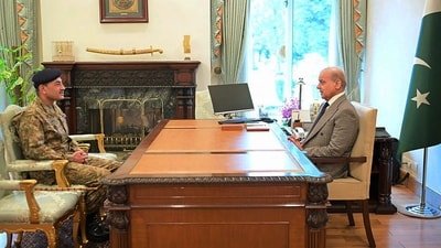 Pakistan's Prime Minister Shehbaz Sharif (R) speaking with Army Chief and Field Marshal Asim Munir at the Prime Minister's House in Islamabad. (AFP)