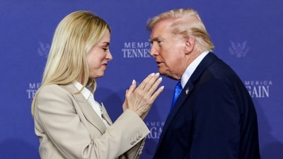 Former Attorney General Pam Bondi applauds as President Donald Trump walks past her at a roundtable on public safety (REUTERS)