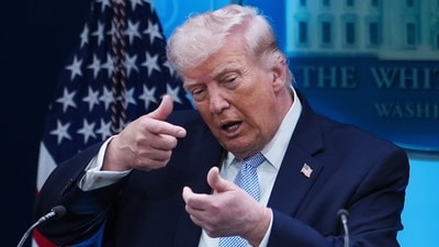 FILE - President Donald Trump pretends to aim a sniper gun while speaking with reporters in the James Brady Press Briefing Room at the White House. (AP Photo/Julia Demaree Nikhinson, File) (AP)