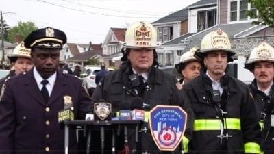 An explosion in Queens sparked a five-alarm fire, injuring ten, including seven police officers. Responding to a dispute, officers faced the blast while trying to enter a residence. Firefighters contained the fire, and investigations are underway regarding the explosion and the initial altercation.