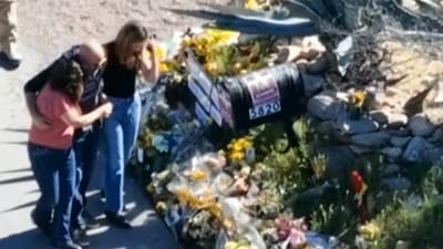 This image made from video provided by FOX News Digital shows Savannah Guthrie, right, her sister Annie Guthrie, left, and her brother-in-law Tommaso Cioni, Monday, March 2, 2026, visiting a tribute to their mother Nancy Guthrie. (FOX News Digital via AP) (AP)