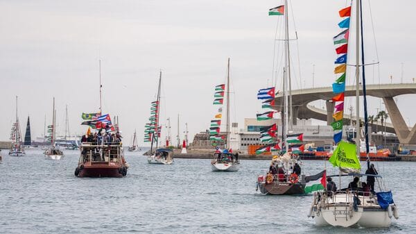 Boats carrying activists and humanitarian aid for Palestinians in Gaza reposition in the port during a symbolic send-off as part of the Global Sumud Flotilla, in Barcelona, Spain