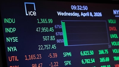 Stock market numbers are displayed on the floor of the New York Stock Exchange during morning trading (Getty Images via AFP)
