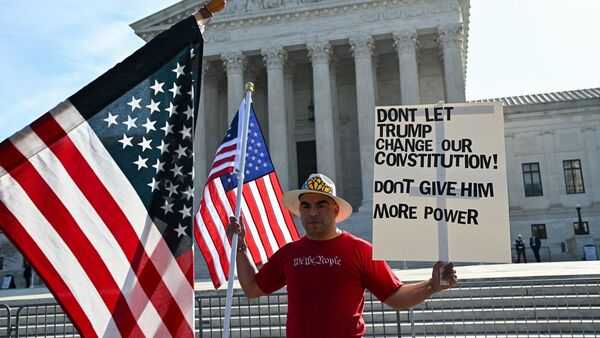 A demonstrator outside the US Supreme Court in Washington, DC, US, on Wednesday, April 1, 2026. Photographer: Graeme Sloan/Bloomberg
