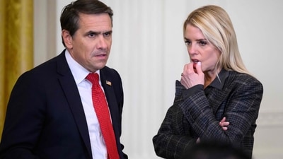 Former Attorney General Pam Bondi (R) speaks with the Deputy Attorney General Todd Blanche following a ceremony with President Donald Trump (AFP)