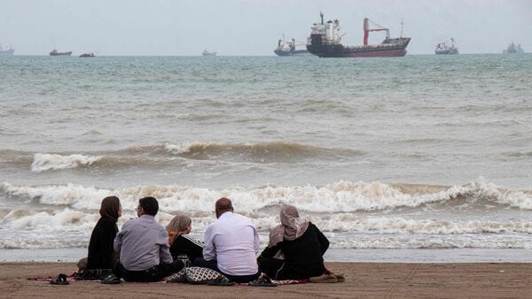 US Iran War LIVE: In this picture obtained from Iran's ISNA news agency on April 24, 2026, Iranians are seen at Suru Beach in Bandar Abbas along the Strait of Hormuz. (Photo by RAZIEH POUDAT / ISNA / AFP)
