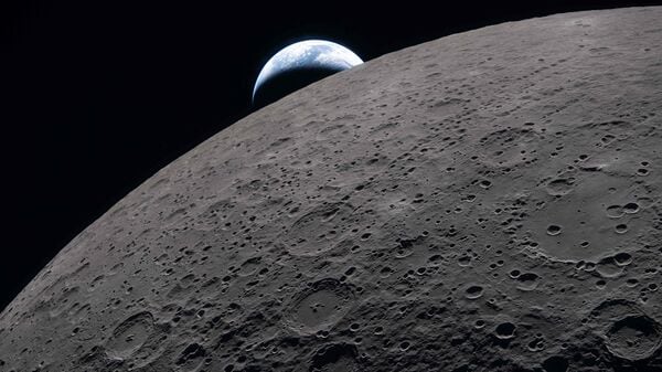 This handout picture released on April 7, 2026, by NASA shows the lunar surface in the foreground while a distant Earth sets in the background at 6:41 PM EDT (20:41 GMT), as seen from the Orion spacecraft on April 6, 2026.