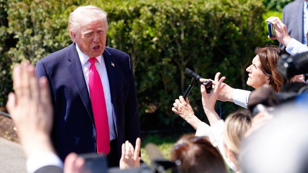 President Donald Trump speaks with reporters before departing on Marine One from the South Lawn of the White House, Thursday, April 16, 2026, in Washington. (AP Photo/Jen Golbeck)