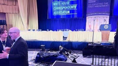 The empty stage is seen after President Donald Trump and other top leaders were evacuated from an annual dinner of White House correspondents on Saturday night. (AP)