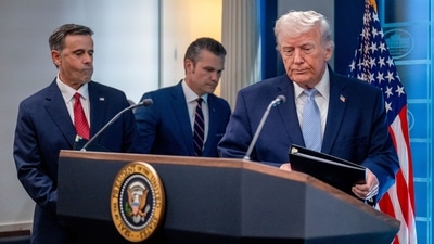 John Ratcliffe, director of the Central Intelligence Agency (CIA), from left, Pete Hegseth, US Secretary of Defence, and US President Donald Trump arrive for a news conference in the James S. Brady Press Briefing Room of the White House in Washington, DC, US, on Monday, April 6, 2026. (Bloomberg)