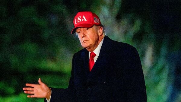 US President Donald Trump walks on the South Lawn of the White House after arriving on Marine One in Washington, DC, US, on Sunday, April 12, 2026. Trump attacked Pope Leo XIV for his criticisms of the US-Israeli war on Iran, calling the leader of the Catholic Church WEAK on crime. Photographer: Bonnie Cash/UPI/Bloomberg