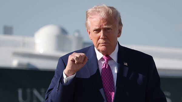 US President Donald Trump walks toward reporters before answering questions prior to boarding Air Force One on April 10, 2026 at Joint Base Andrews, Maryland.